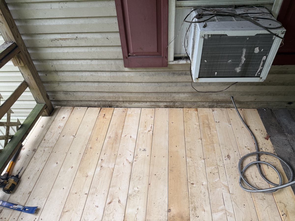 The finished porch, newly decked with fresh boards.